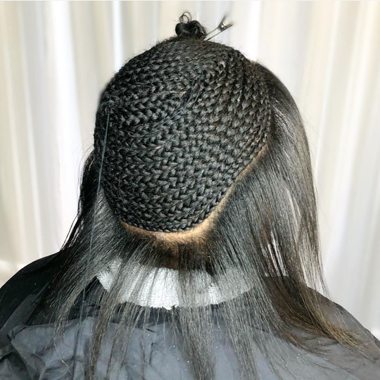 Seamless sew-in braid foundation with leave-out prepared for a smooth extension install in Arlington, Texas.