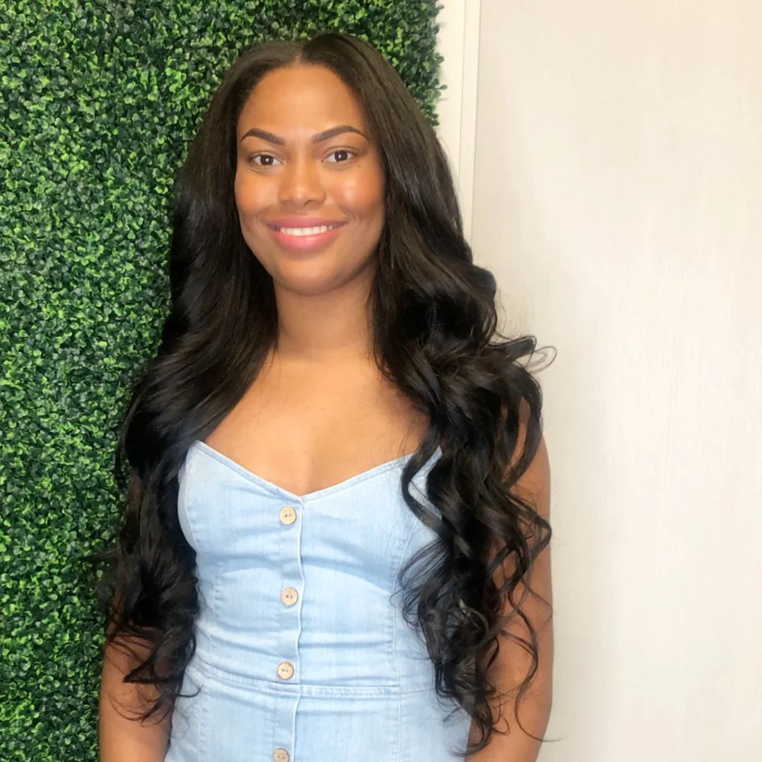 Natural-looking wavy hair extensions with soft curls in Arlington, Texas.